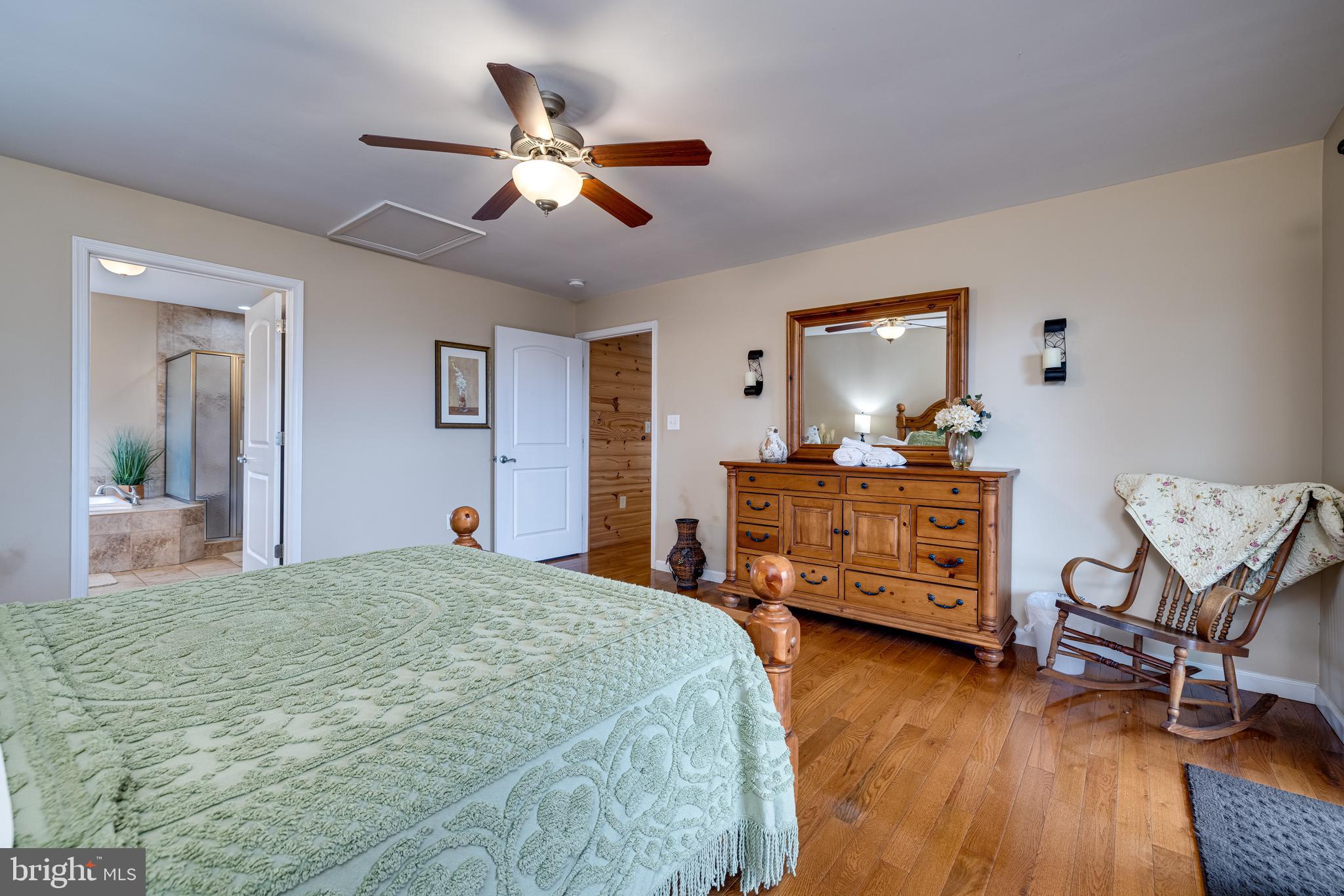 2225 Valley Burg Road Luray, VA 22835 - Photo 52 of 74 a bedroom with a bed and wooden floor