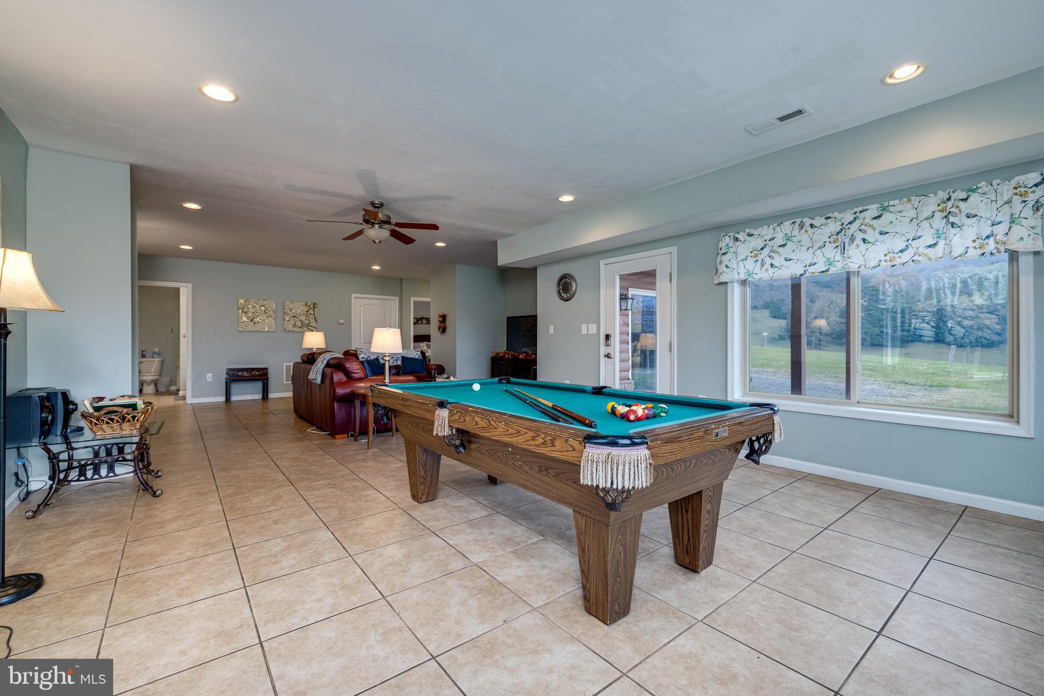 2225 Valley Burg Road Luray, VA 22835 - Photo 63 of 74 a living room with furniture a table and a large window