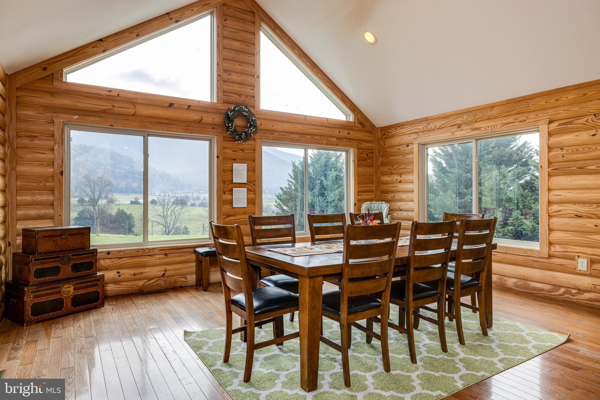 2225 Valley Burg Road Luray, VA 22835 - Photo 7 of 74 a dining room with furniture large windows and wooden floor
