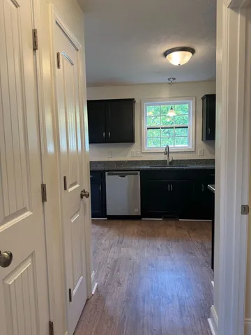 a view of kitchen with wooden floor and window