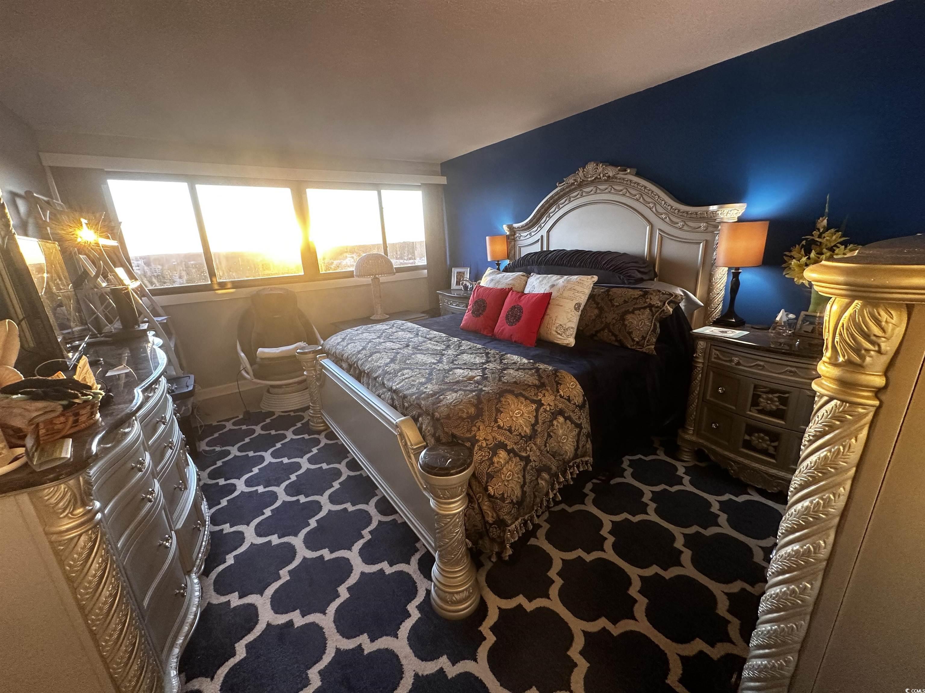 601 Mitchell Drive, Unit 1401 Myrtle Beach, SC 29577 - Photo 9 of 25 Bedroom featuring dark carpet and baseboards