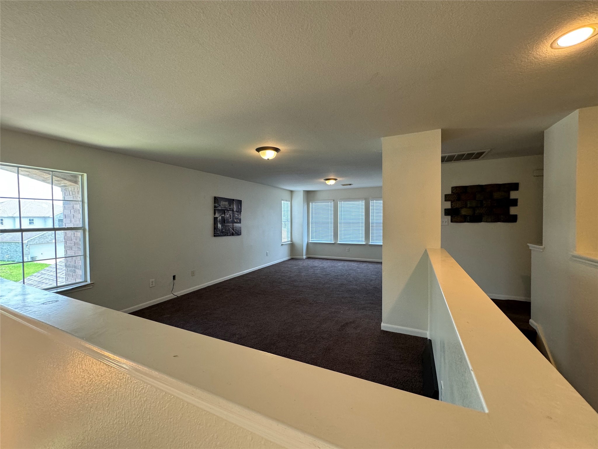 8138 Wooded Terrace Lane Humble, TX 77338 - Photo 15 of 36 a view of a hallway to a room with windows