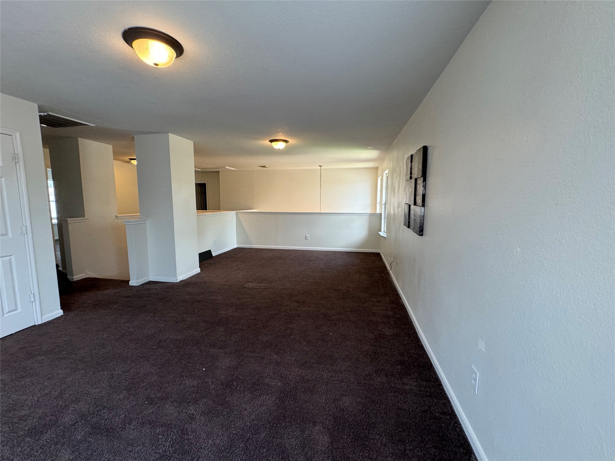 8138 Wooded Terrace Lane Humble, TX 77338 - Photo 17 of 36 a view of empty room with window and wooden floor