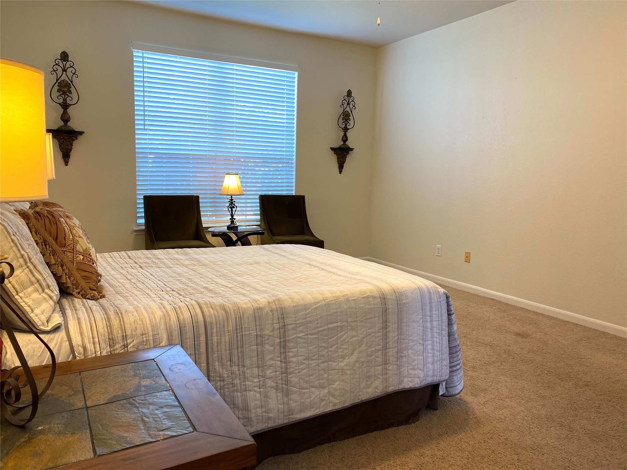 8138 Wooded Terrace Lane Humble, TX 77338 - Photo 18 of 36 a bed sitting in a bedroom and chair