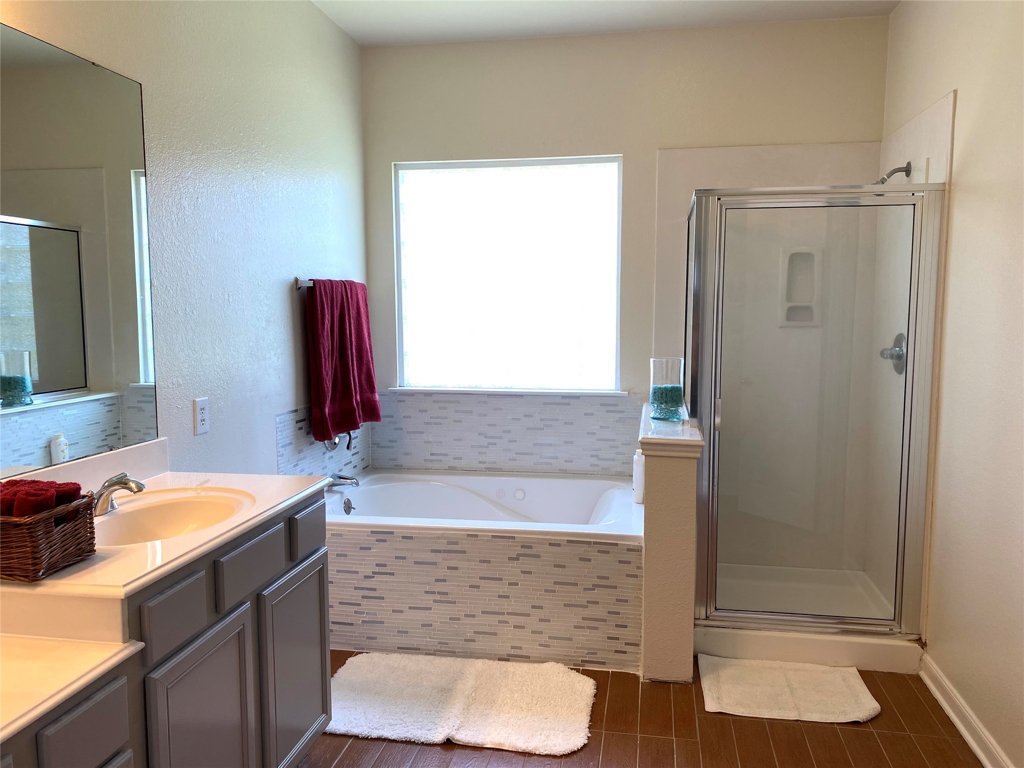8138 Wooded Terrace Lane Humble, TX 77338 - Photo 23 of 36 a bathroom with a sink and a mirror
