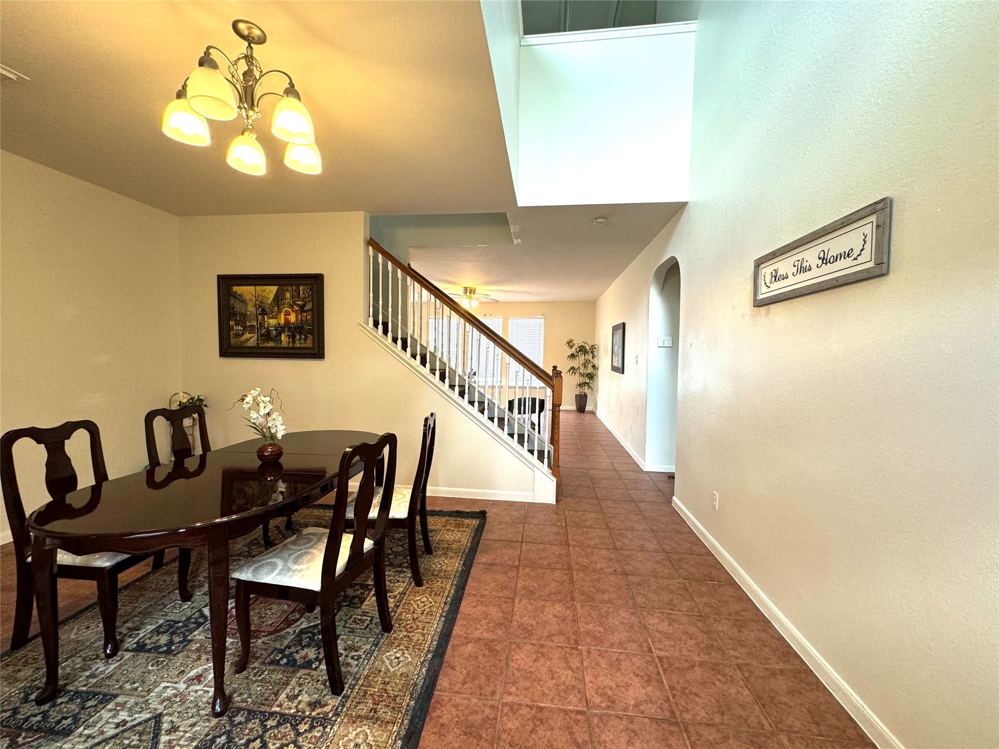 8138 Wooded Terrace Lane Humble, TX 77338 - Photo 9 of 36 a view of a dining room with furniture and a chandelier