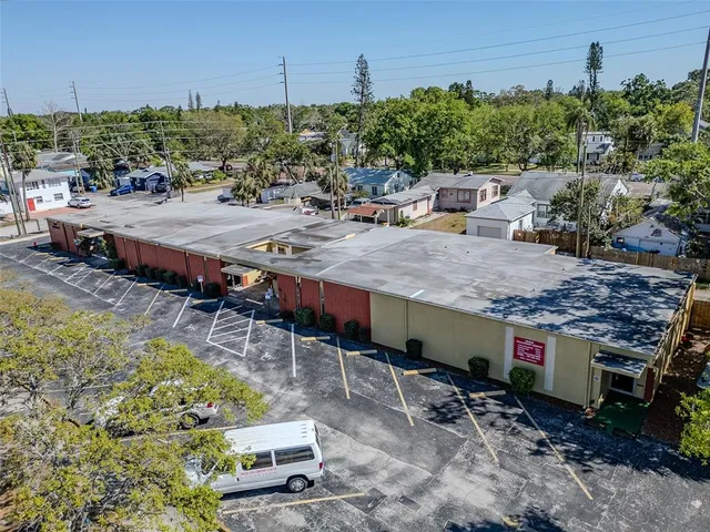 a view of a backyard with sitting area