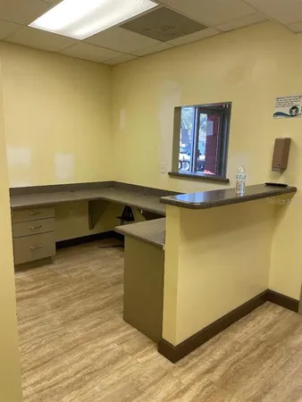 a kitchen with a sink and a stove top oven