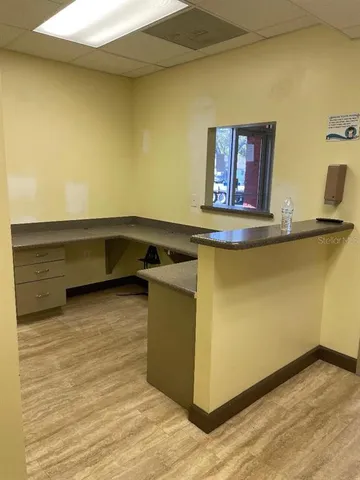 a kitchen with a sink and a stove top oven