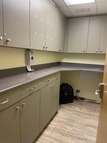 a kitchen with a sink and cabinets