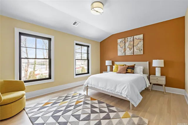 a bedroom with a bed and a couch