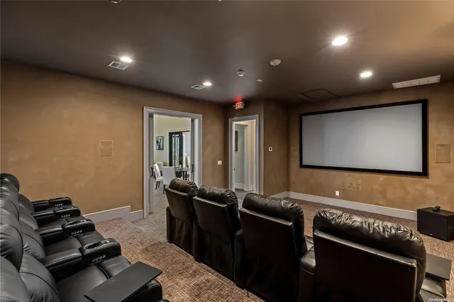 a room with furniture pool table and projector