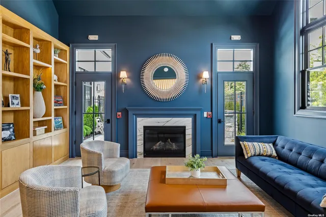 a living room with furniture a window and a fireplace