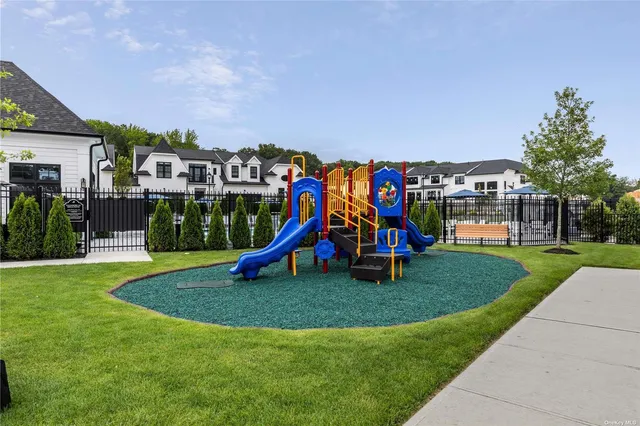 a view of a park with swings and slides