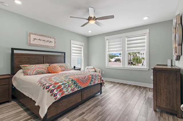 a bedroom with a large bed and a window