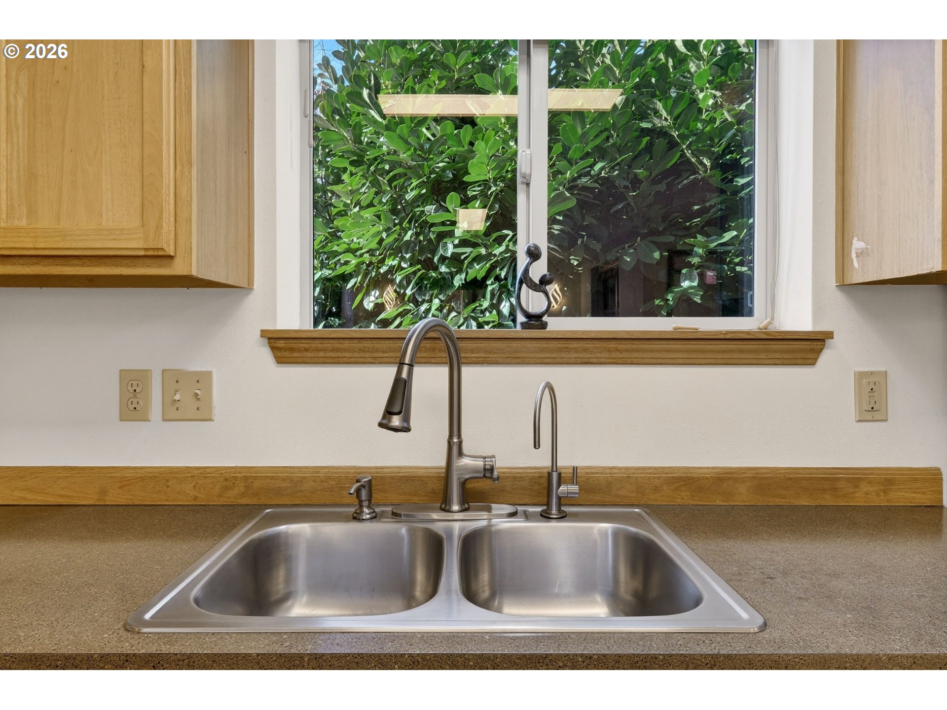 12132 Southeast Pardee Street Portland, OR 97266 - Photo 16 of 35 a kitchen with a sink and a window