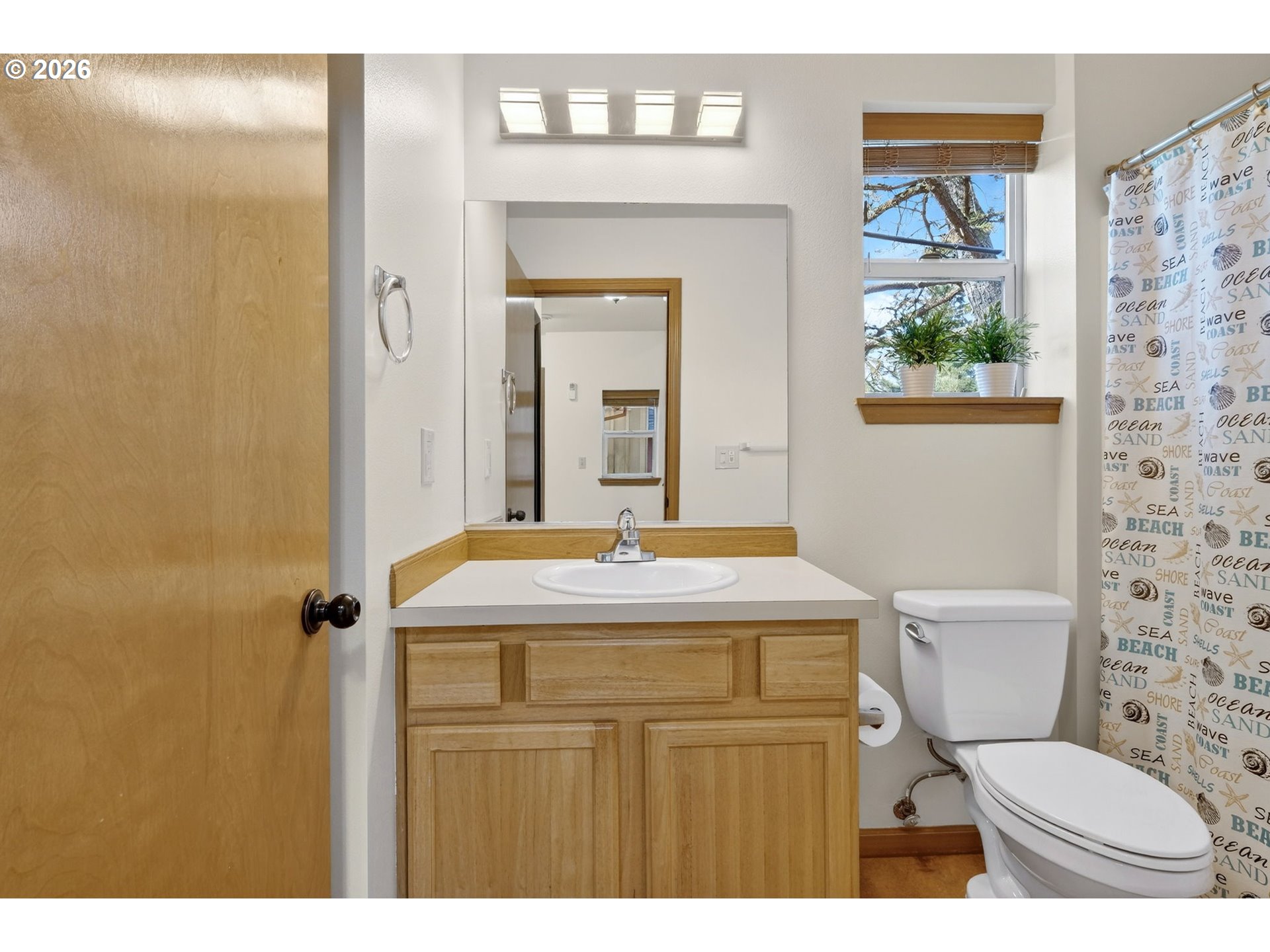 12132 Southeast Pardee Street Portland, OR 97266 - Photo 25 of 35 a bathroom with a toilet a sink and a shower