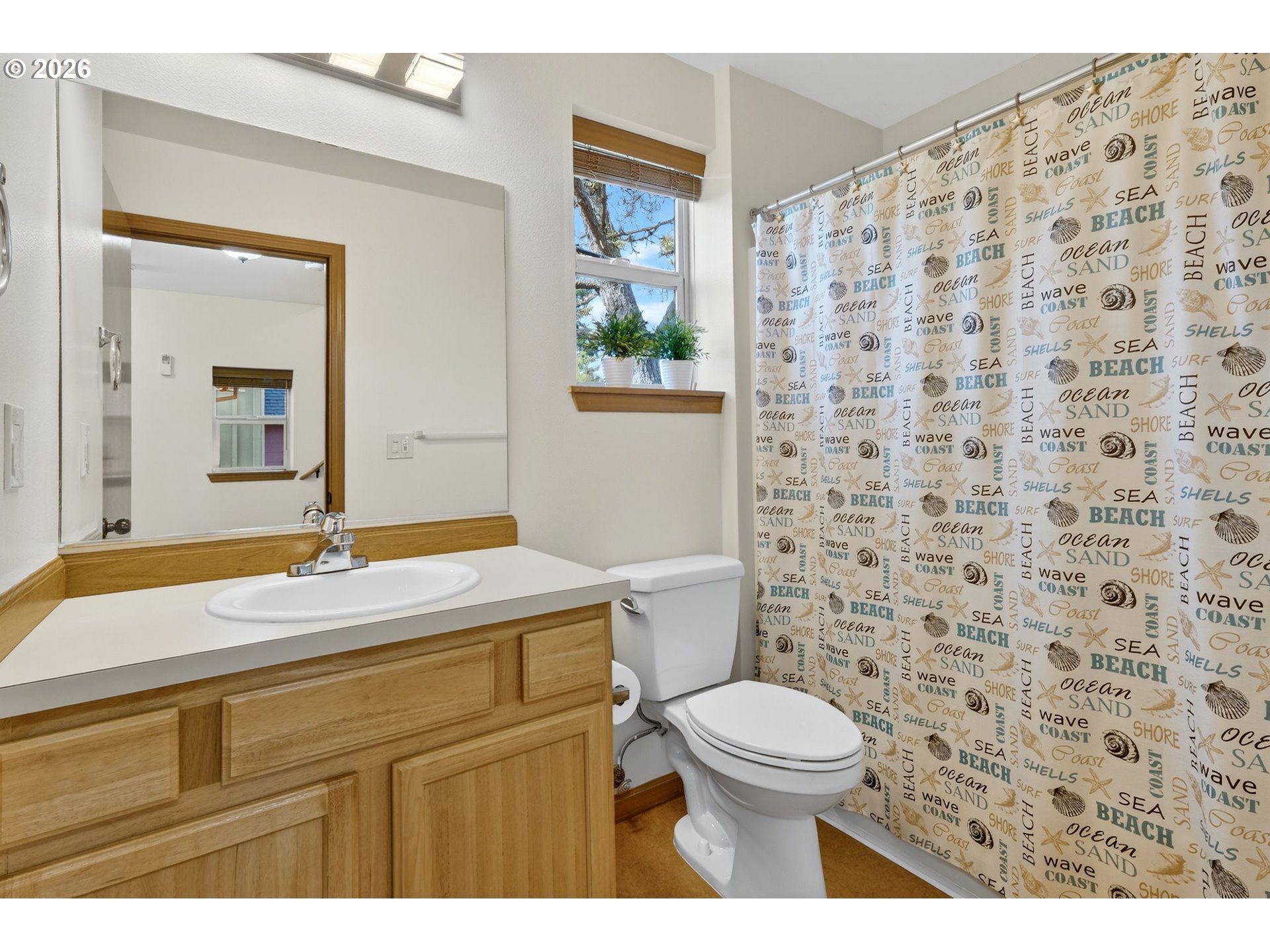 12132 Southeast Pardee Street Portland, OR 97266 - Photo 26 of 35 a bathroom with a granite countertop sink a toilet and a mirror