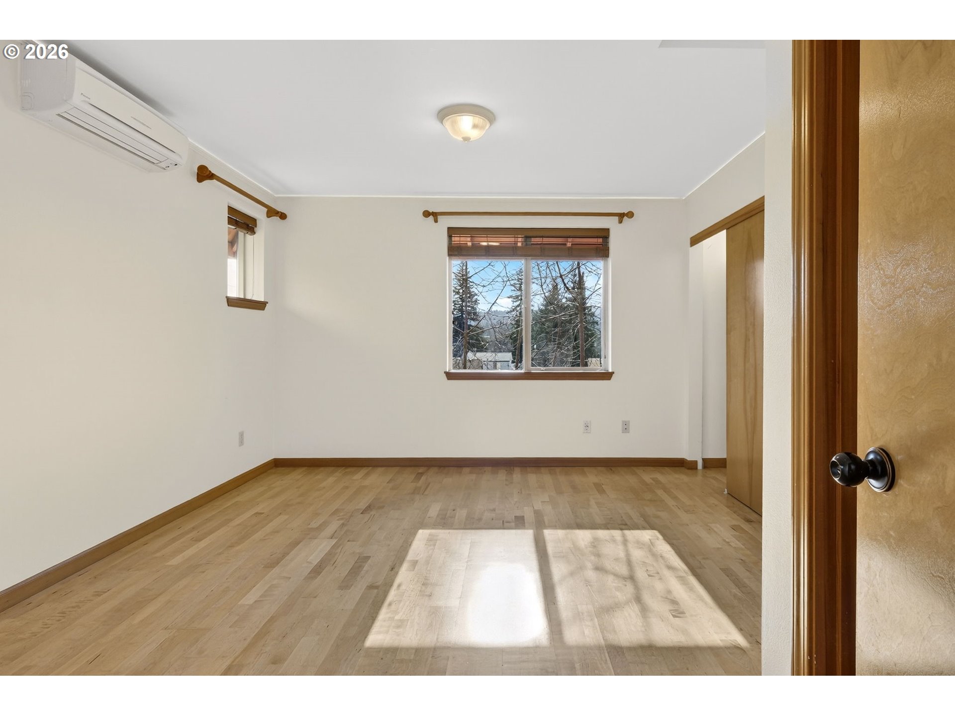 12132 Southeast Pardee Street Portland, OR 97266 - Photo 27 of 35 a view of an empty room with a window