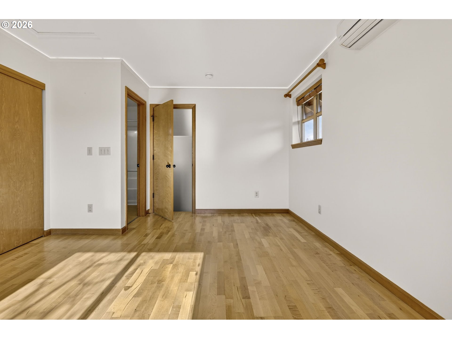 12132 Southeast Pardee Street Portland, OR 97266 - Photo 30 of 35 a view of an empty room with wooden floor