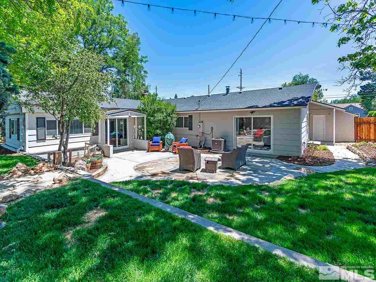 2065 Plumas Street Reno, NV 89509 - Photo 5 of 21 a view of a patio with table and chairs potted plants and large tree