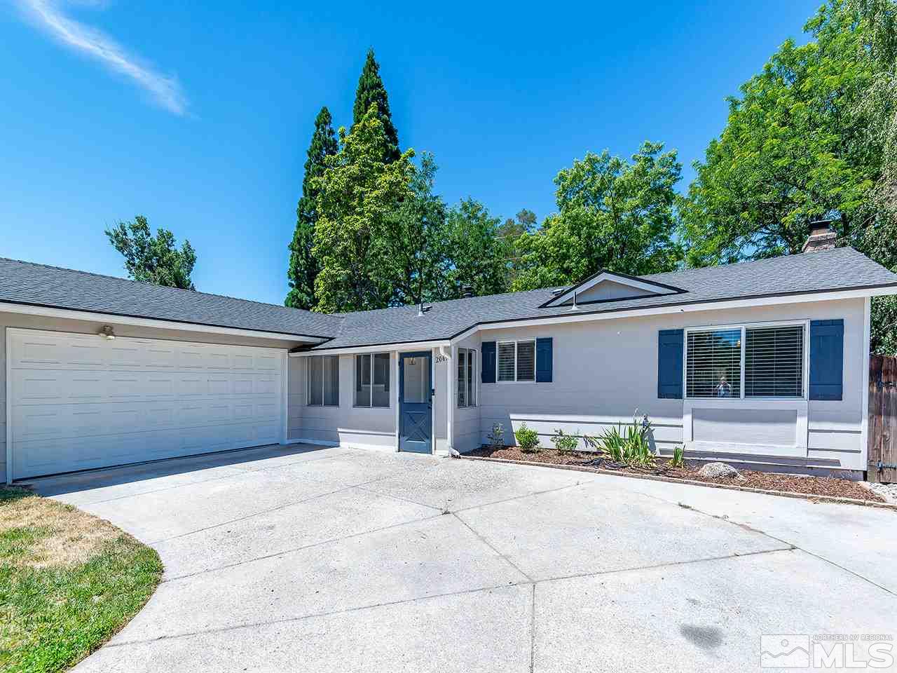 2065 Plumas Street Reno, NV 89509 - Photo 8 of 21 a front view of a house with a garden