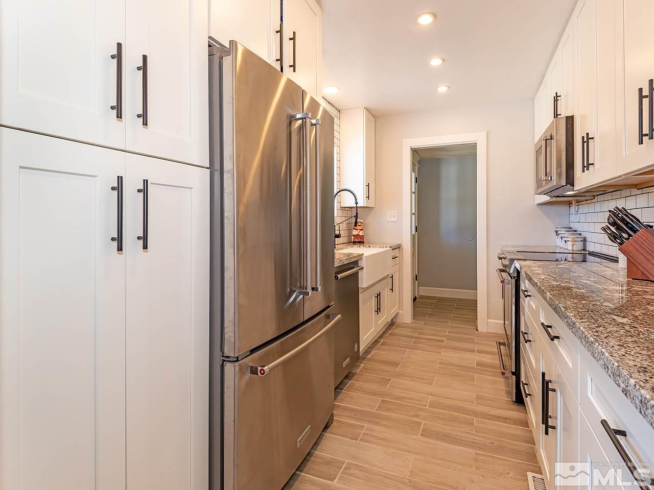 2065 Plumas Street Reno, NV 89509 - Photo 10 of 21 a kitchen with stainless steel appliances a refrigerator and a sink