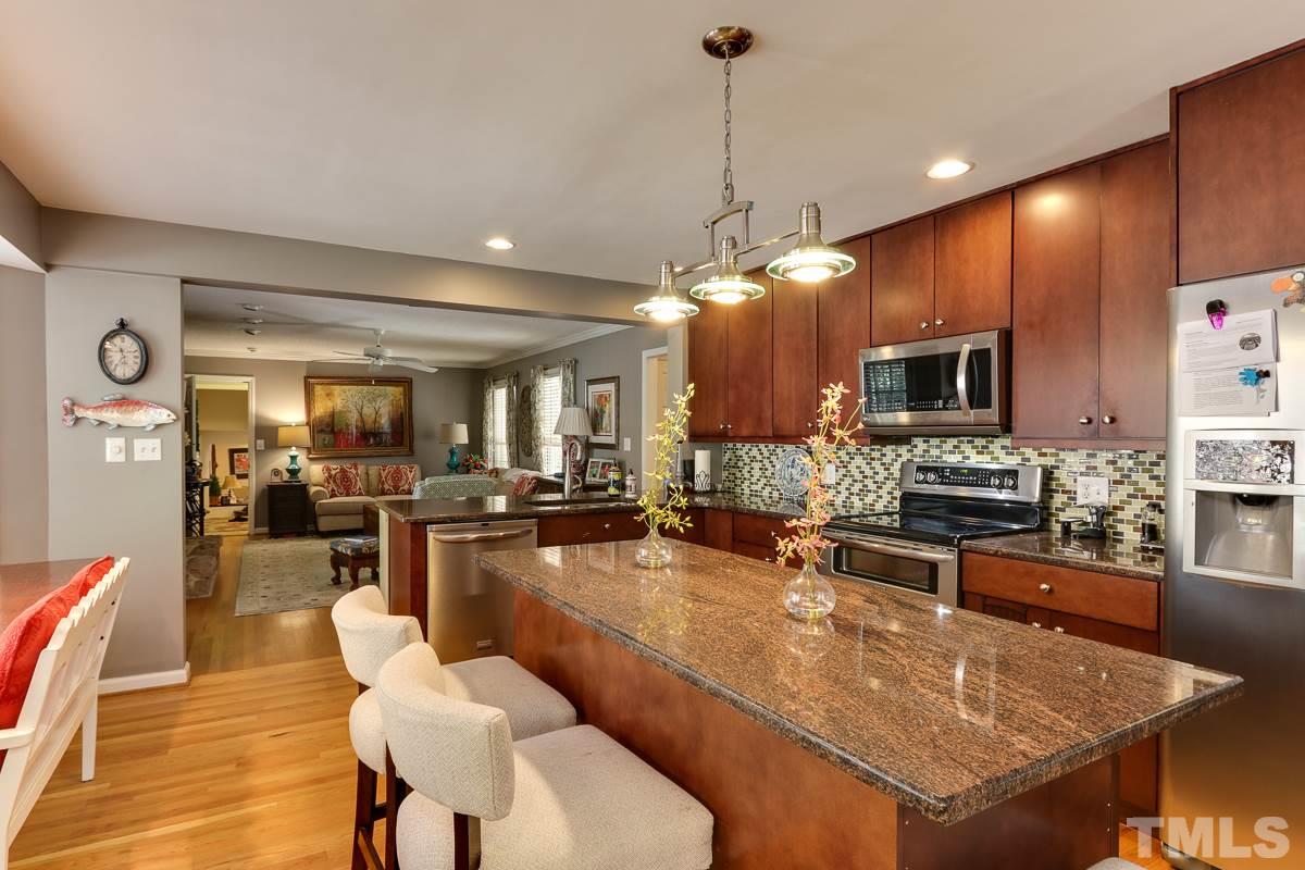 1705 Pony Run Road Raleigh, NC 27615 - Photo 2 of 22 a large kitchen with a table and chairs
