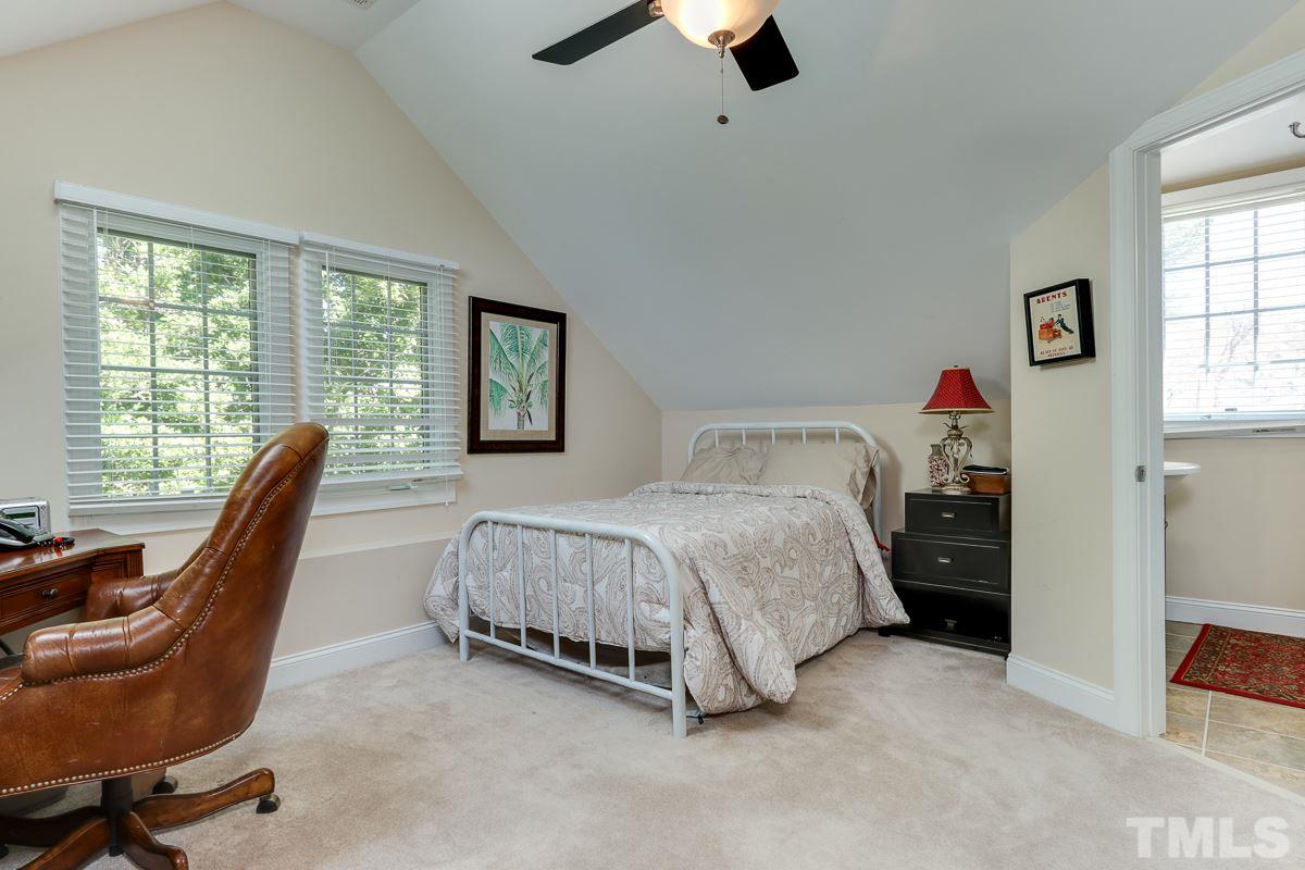 1705 Pony Run Road Raleigh, NC 27615 - Photo 17 of 22 a bedroom with a bed and a large window
