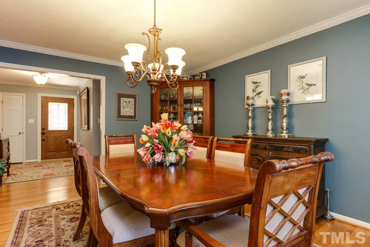 1705 Pony Run Road Raleigh, NC 27615 - Photo 5 of 22 a dining room with furniture and chandelier