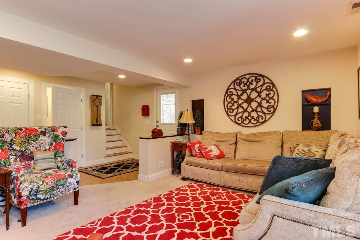 1705 Pony Run Road Raleigh, NC 27615 - Photo 10 of 22 a living room with furniture and a rug