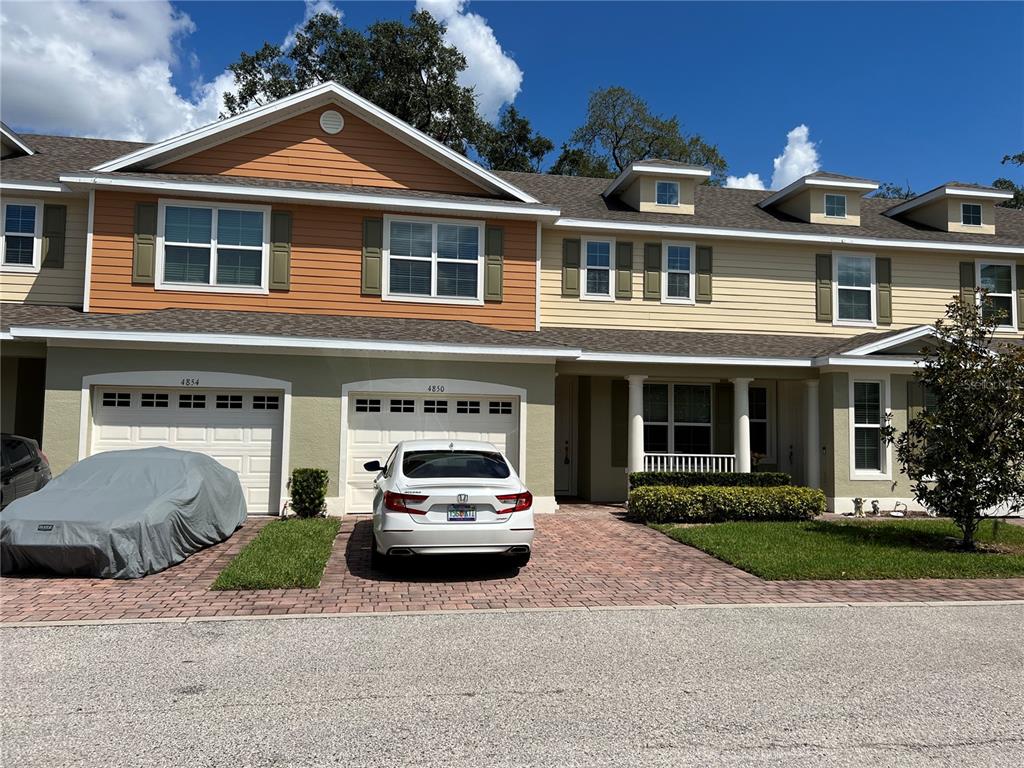 4850 Poolside Drive St. Cloud, FL 34769 - Photo 1 of 1 a car parked in front of a house