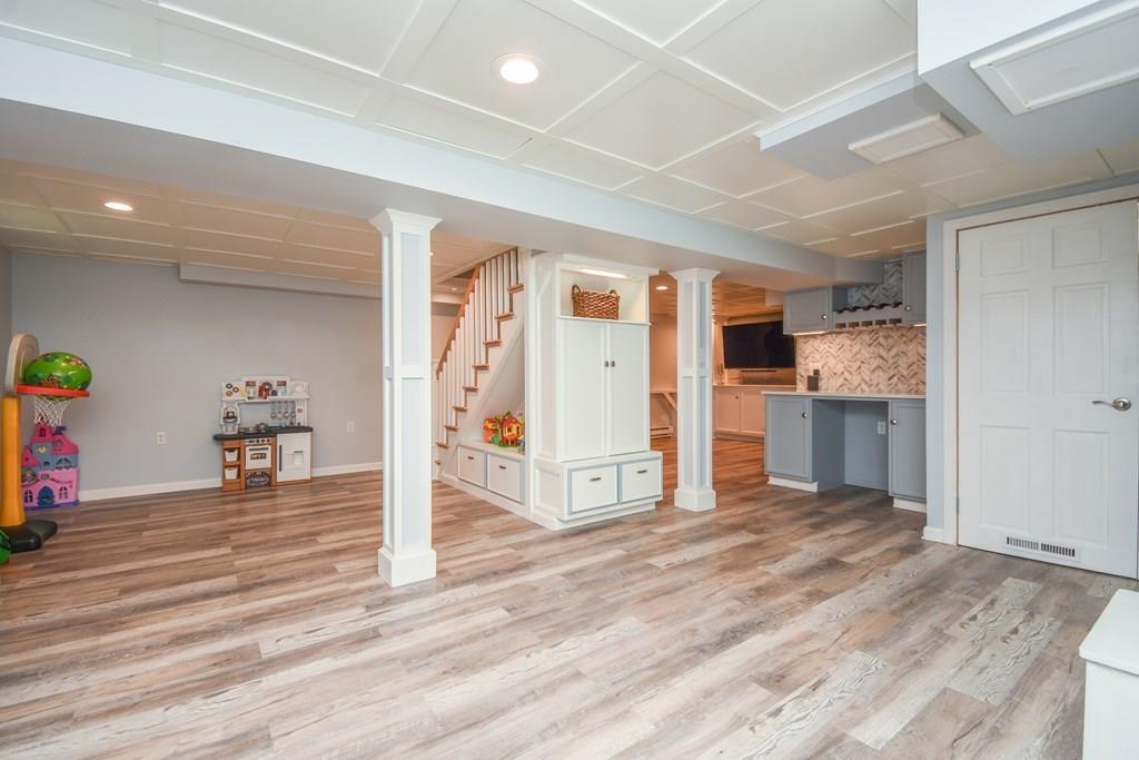 121 Moreland Road Weymouth, MA 02191 - Photo 25 of 40 a view of a kitchen with a sink and a refrigerator