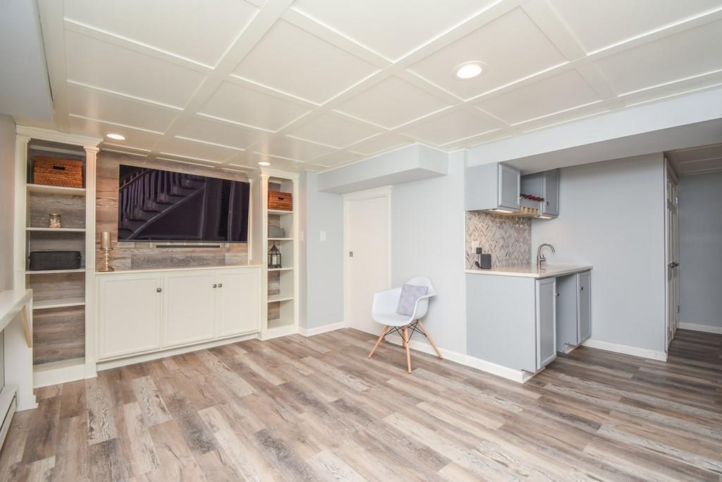 121 Moreland Road Weymouth, MA 02191 - Photo 29 of 40 a room with a furniture and a flat screen tv