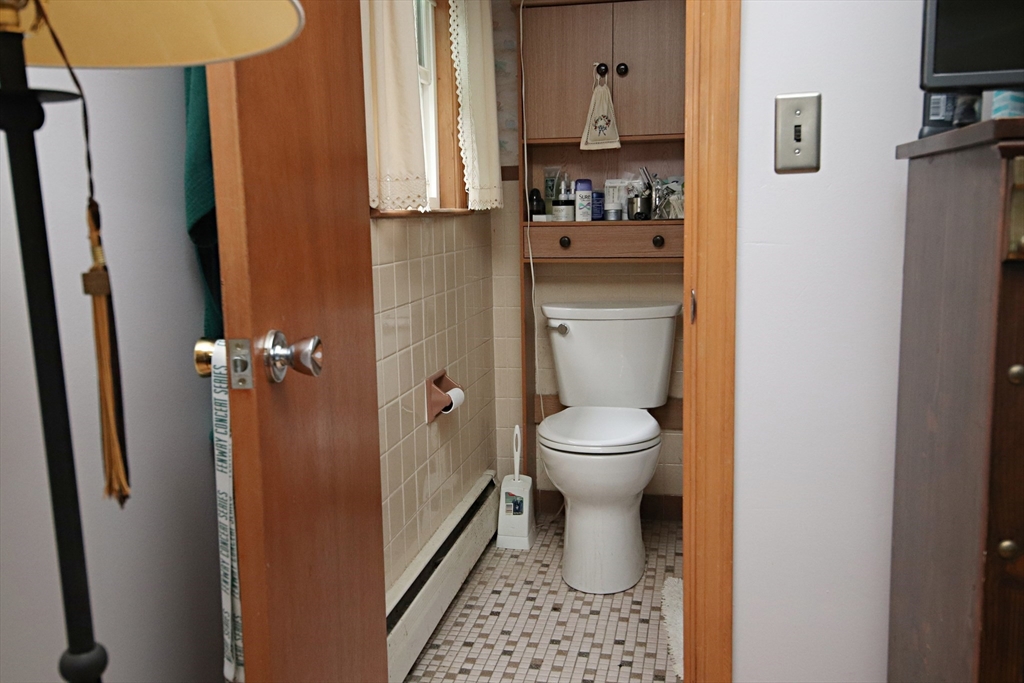 61 Central Street Saugus, MA 01906 - Photo 16 of 42 a bathroom with a toilet and a shower