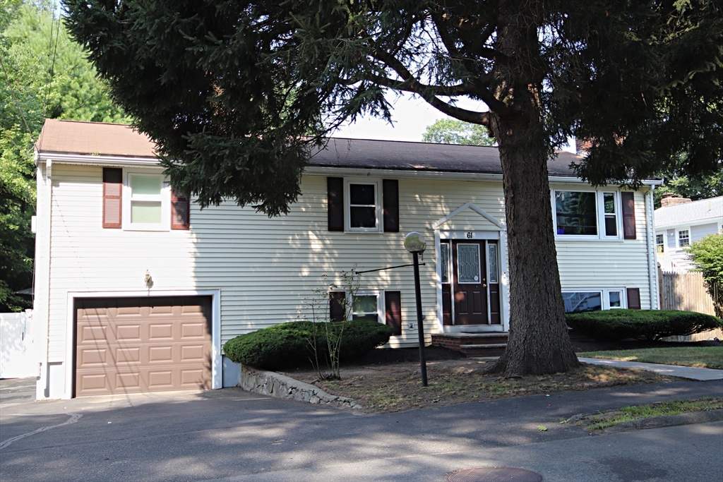 61 Central Street Saugus, MA 01906 - Photo 2 of 42 a front view of a house with a yard