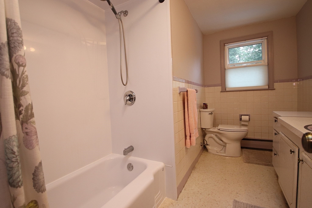 61 Central Street Saugus, MA 01906 - Photo 22 of 42 a bathroom with a toilet sink and a bathtub