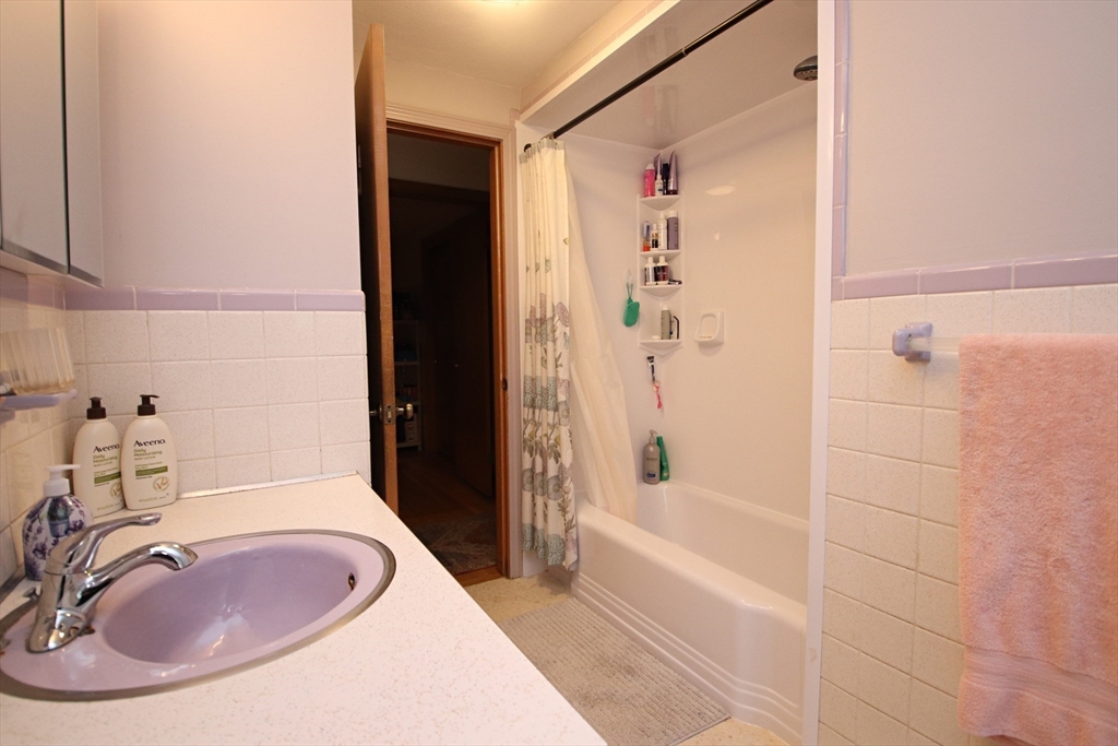 61 Central Street Saugus, MA 01906 - Photo 23 of 42 a bathroom with a sink and a tub