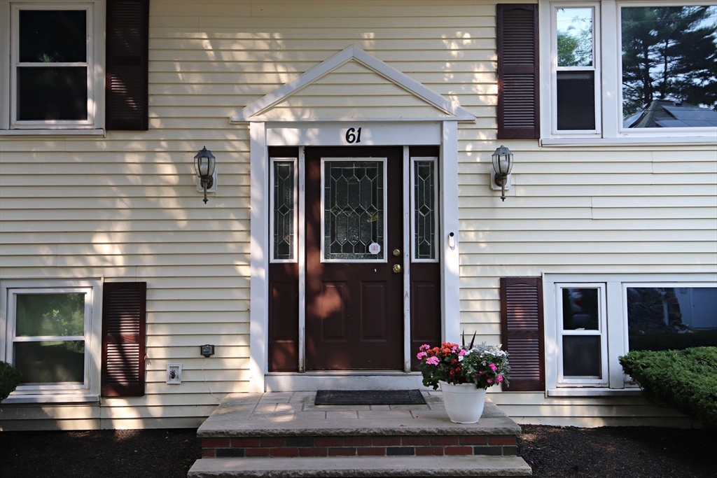 61 Central Street Saugus, MA 01906 - Photo 3 of 42 a view of a house with entrance door and potted plants