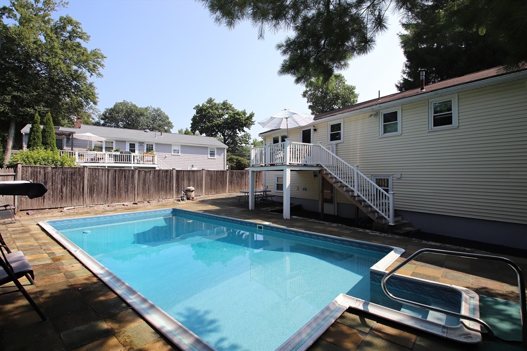 61 Central Street Saugus, MA 01906 - Photo 39 of 42 a view of a balcony with two chairs and a table