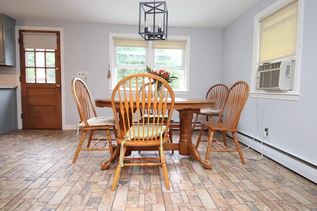 61 Central Street Saugus, MA 01906 - Photo 9 of 42 a view of a dining room with furniture window and wooden floor