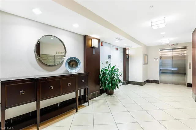 a bathroom with a sink mirror and vanity
