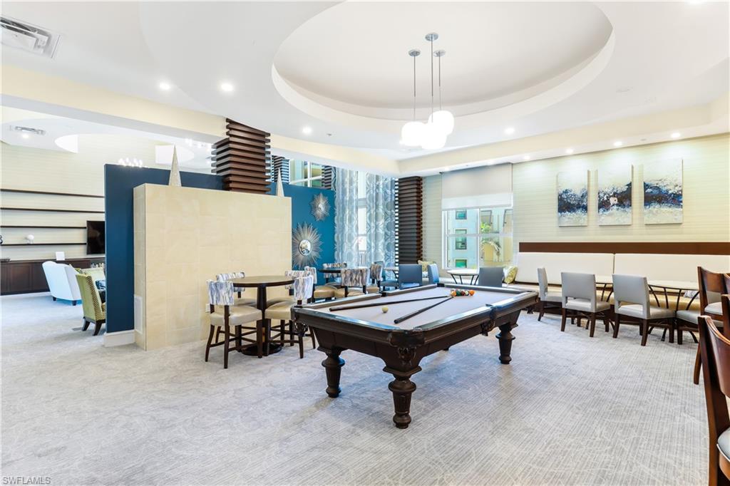 9123 Strada Place, Unit 7306 Naples, FL 34108 - Photo 18 of 19 a room with furniture pool table and windows