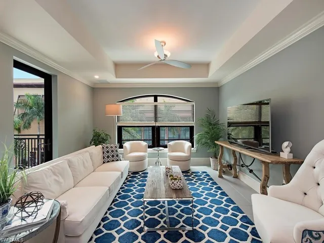 a living room with furniture a window and a fireplace