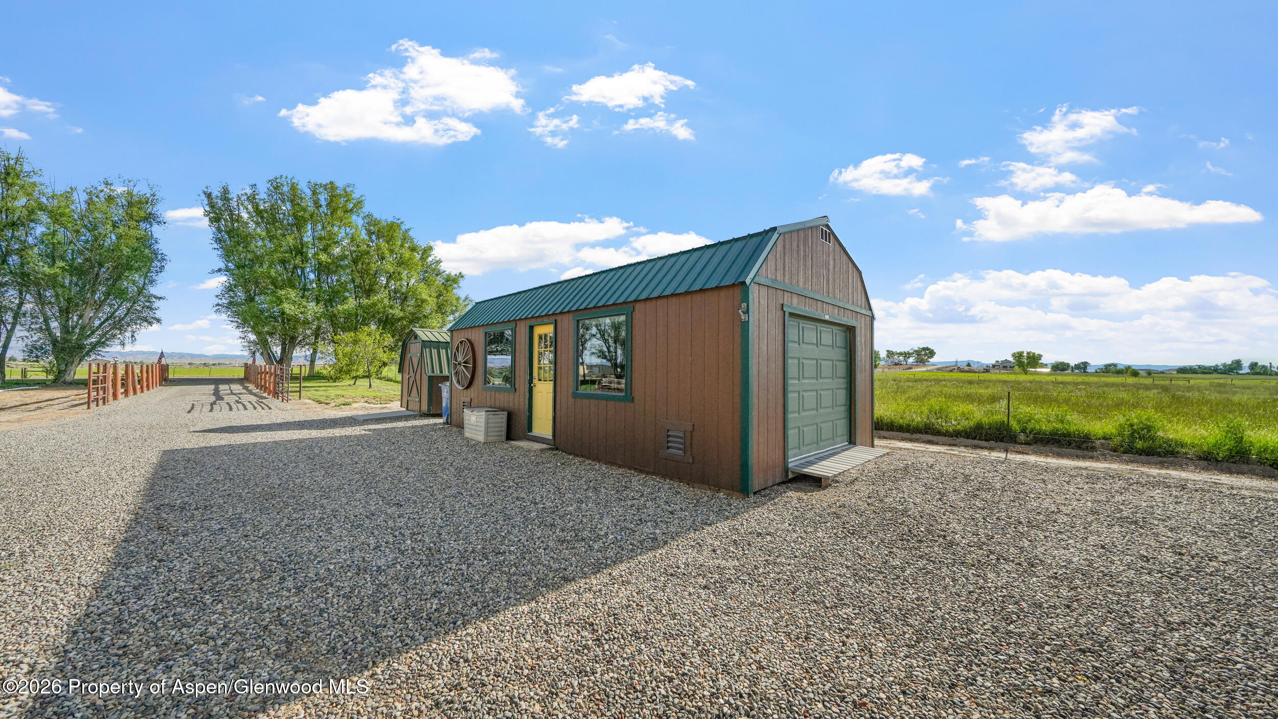 1355 N Road Loma, CO 81524 - Photo 42 of 51 a view of a house with backyard and a garden