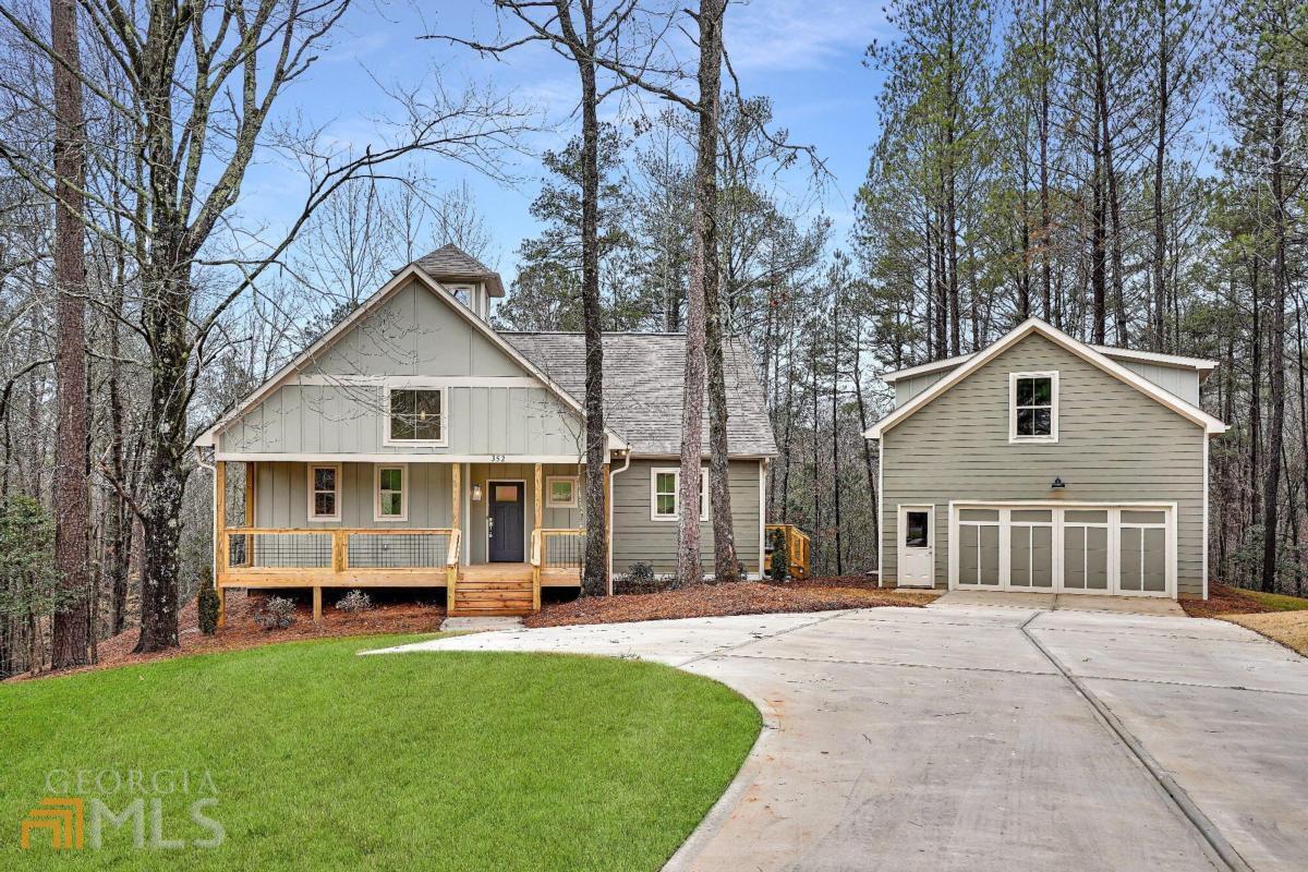 352 Bridge Road, Unit 16 Ellijay, GA 30540 - Photo 1 of 1 a front view of a house with a yard