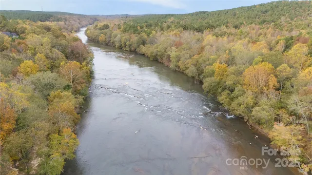 a view of a pathway with a yard