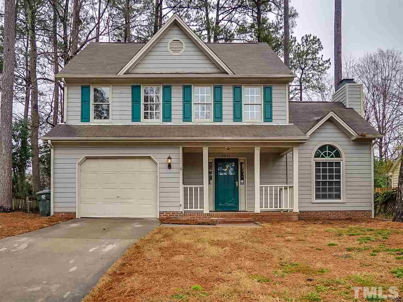 5813 Edgebury Road Raleigh, NC 27613 - Photo 1 of 21 a front view of a house with a yard and garage