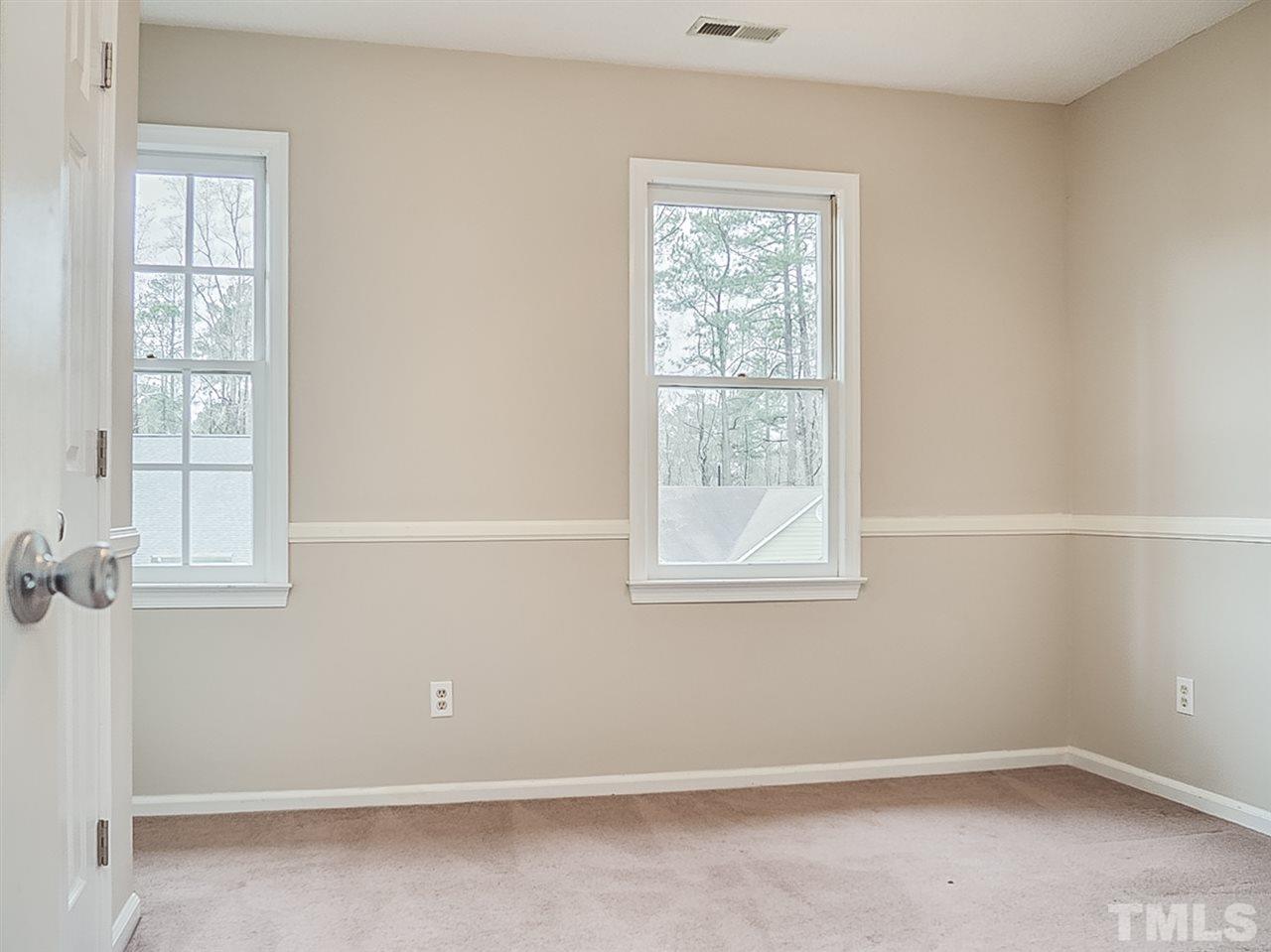 5813 Edgebury Road Raleigh, NC 27613 - Photo 16 of 21 an empty room with a window