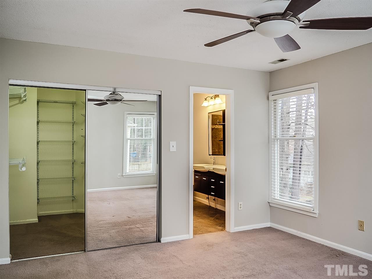 5813 Edgebury Road Raleigh, NC 27613 - Photo 9 of 21 a view of empty room with windows and cabinet